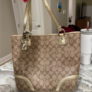 Coach Heritage Signature Star Tote bag in brown and gold with PVC material